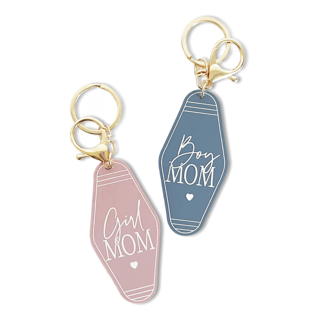 http://cottonandcanvasco.com/cdn/shop/files/GirlMomandBoyMom_MotelKeychain_Lifestyle-WhiteBackground_1024x1024.jpg?v=1683659612